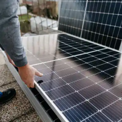 person holding solar panels