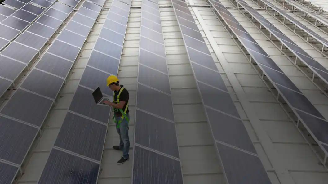 worker working in solar farm