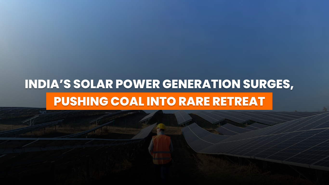 solar panels in India with coal plant in the background symbolizing energy shift