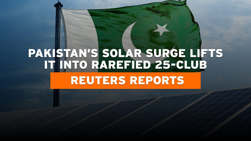 Aerial view of a solar farm in Pakistan with sunlit panels and green terrain, symbolizing clean energy growth