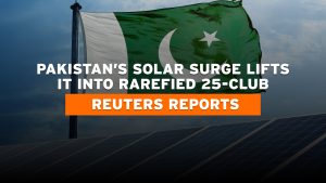 Aerial view of a solar farm in Pakistan with sunlit panels and green terrain, symbolizing clean energy growth